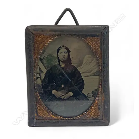 Metal framed ambrotype - Seated woman with book,